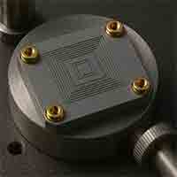 Silicon Ultrasonic Sensor with Thick Wafer Microstructures – Acoustic MEMS Design silicon-based ultrasonic transducer mounted on metallic base, showing thick wafer structure and micro-etched patterns