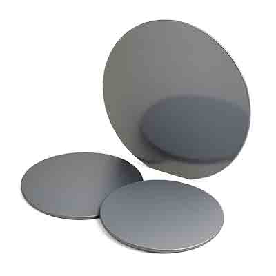 Three doped silicon wafers with reflective surfaces, including one standing upright and two lying flat