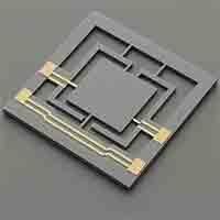 MEMS actuator on silicon substrate with gold microstructures and suspended beams.