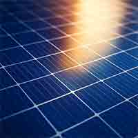 blue solar cell array with reflected sunlight, illustrating multijunction photovoltaic technology