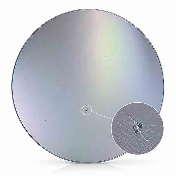 Silicon wafer with magnified close-up view of crystalline defects, micro-scratches, and particle contamination